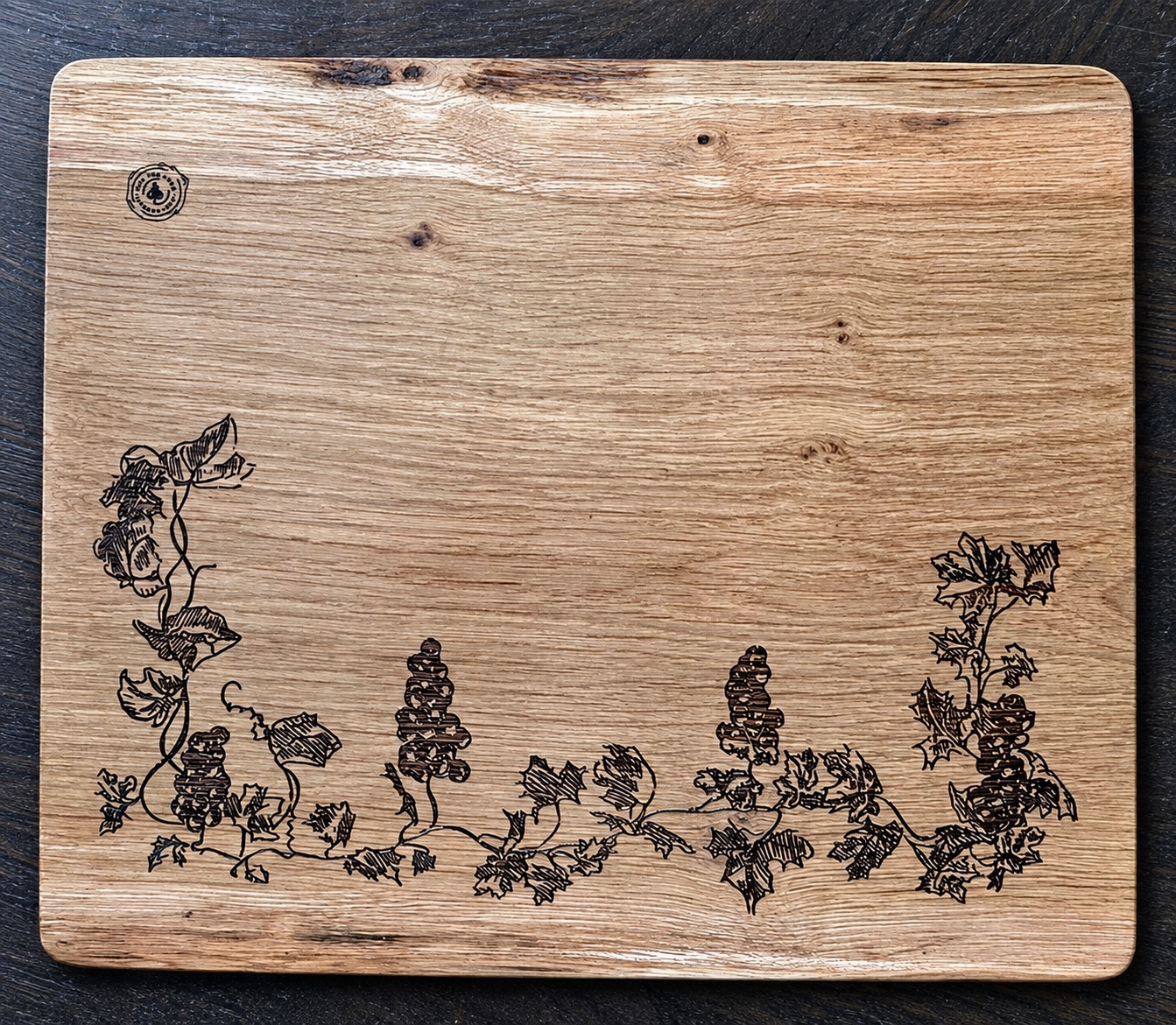 Reference PL 9 — local ash board with an engraved vine border — 35 × 30 cm