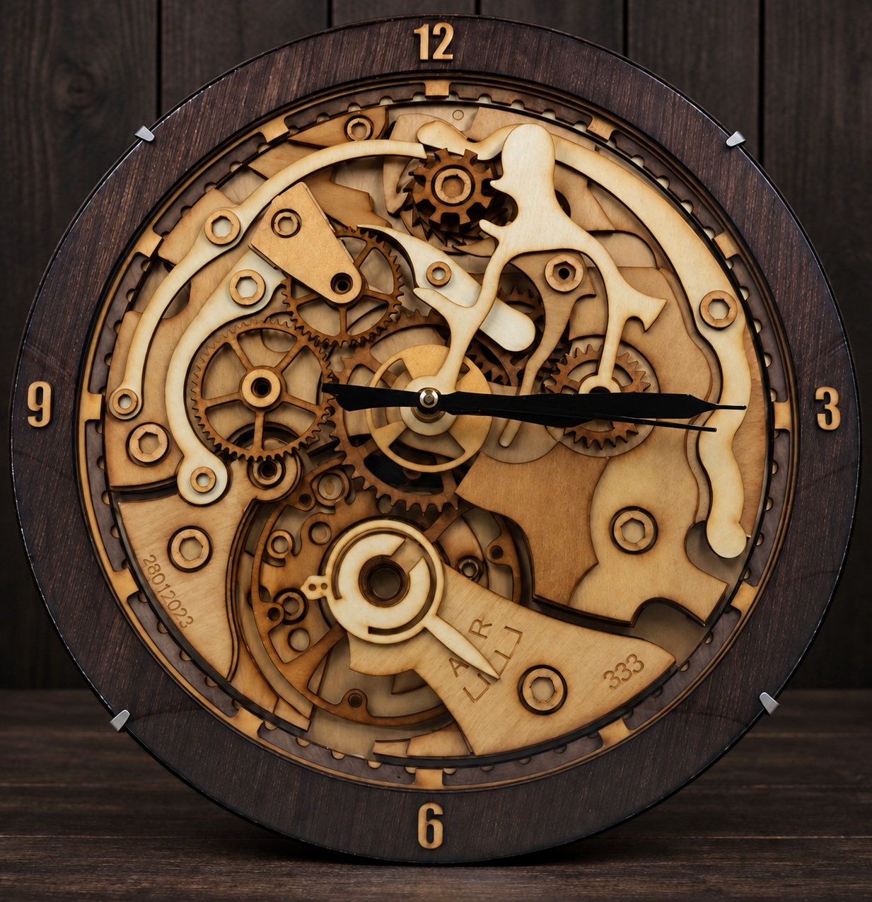Reference HO 1 — layered mechanical wooden clock on a dark studio background