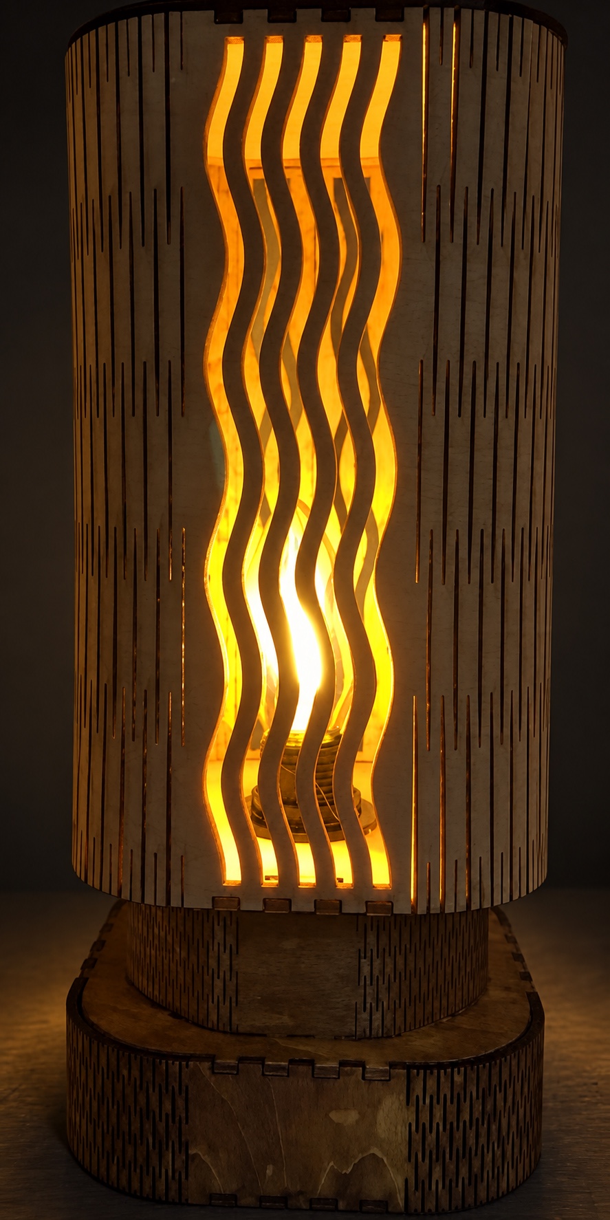 Reference LA 2b — illuminated wooden wave lamp in a dark room